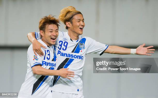 Gamba Osaka forward Usami Takashi celebrates after scoring his goal with Gamba Osaka Midfielder Abe Hiroyuki during the 2015 AFC Champions League...