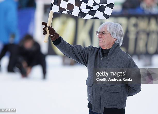 Bernie Ecclestone waves the finish flag at 'Kitz Charity Race' during Hahnenkamm Race weekend on January 24, 2009 in Kitzbuehel, Austria.
