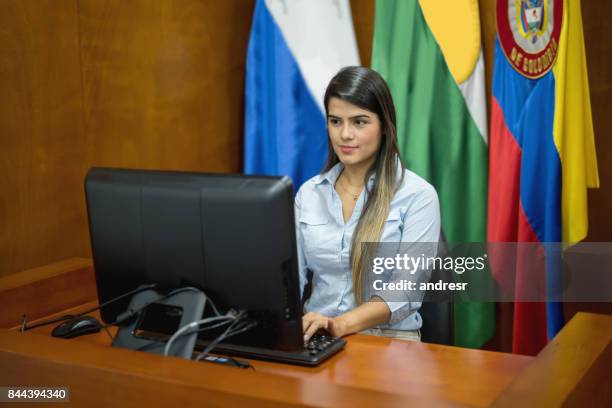 clerk working at the courtroom typing the session - file clerk stock pictures, royalty-free photos & images
