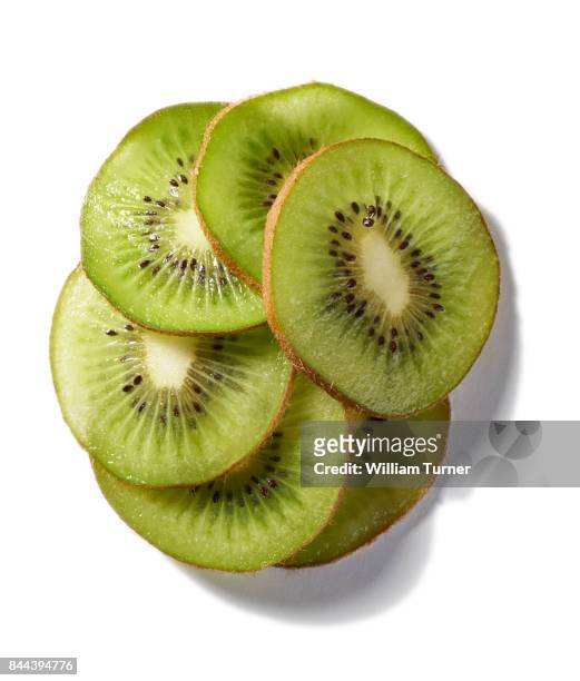 a cut out food image of kiwi fruit slices - william turner london stockfoto's en -beelden