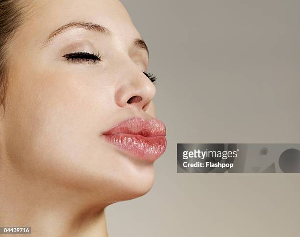 woman with big lips pouting - quirky kissing foto e immagini stock