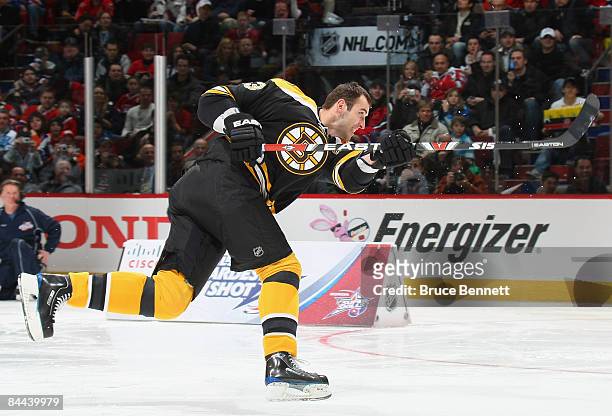 Eastern Conference All-Star Zdeno Chara of the Boston Bruins competes in the "Cisco Hardest Shot" during the Honda NHL Superskills competition as...