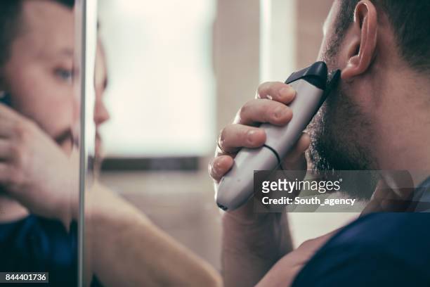 using electric razor for beard - razor stock pictures, royalty-free photos & images