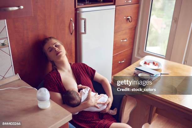 so tired mother - mom and baby sleeping stock pictures, royalty-free photos & images
