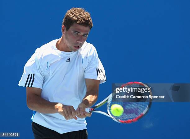 Alexandros-Ferdinandos Georgoudas of Germany plays a backhand in his junior boys match against Andrew Whittington of Australia during day seven of...