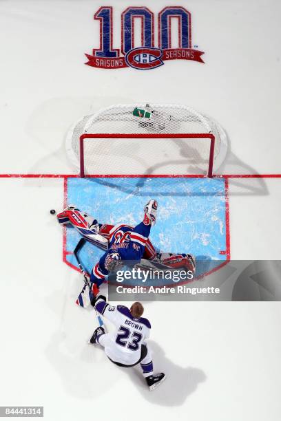 Eastern Conference All-Star Henrik Lundqvist of the New York Rangers makes a save against Dustin Brown of the Los ANgeles Kings as they compete in...