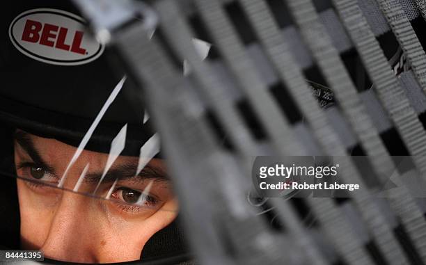 Joey Logano driver of the Joe Gibbs Driven Toyota sits in his car during qualifying for the NASCAR Camping World Series race during the NASCAR Toyota...