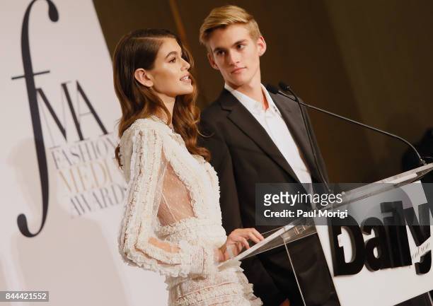 Kaia Gerber and Presley Gerber present an award onstage during the Daily Front Row's Fashion Media Awards at Four Seasons Hotel New York Downtown on...
