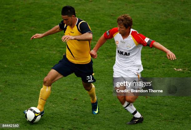 Daniel Taylor of the Mariners competes with Andrew Ciarla of United during the National Youth League round 18 match between the Central Coast...