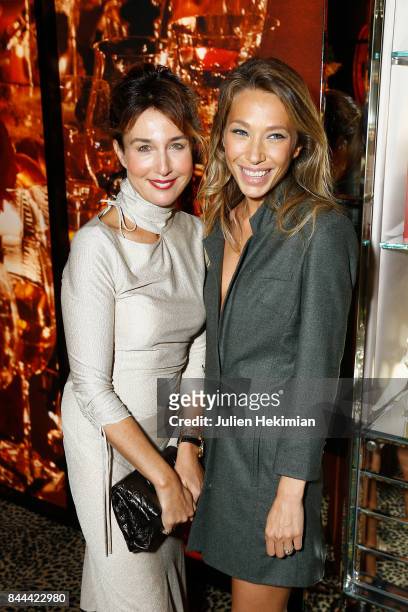 Elsa Zylberstein and Laura Smet attend the Baccarat Goldfinger party in paris on September 8, 2017 in Paris, France.