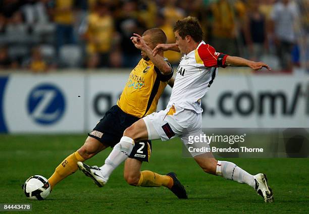 Andre Gumprecht of the Mariners competes with Scott Jamieson of United during the round 21 A-League match between the Central Coast Mariners and...