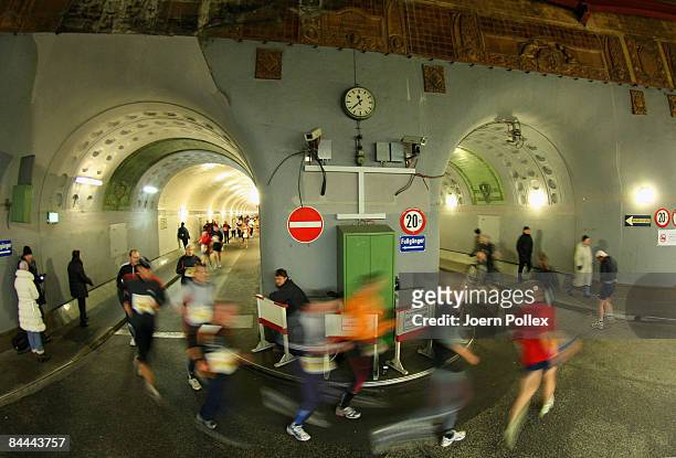Athletes run through Hamburg's old Elbtunnel undercrossing the Elbe river during the 10th edition of the northern city's traditional Elbtunnel...