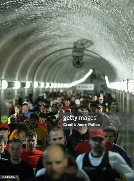 Athletes run through Hamburg's old Elbtunnel undercrossing the Elbe river during the 10th edition of the northern city's traditional Elbtunnel...