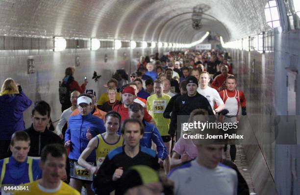 Athletes run through Hamburg's old Elbtunnel undercrossing the Elbe river during the 10th edition of the northern city's traditional Elbtunnel...