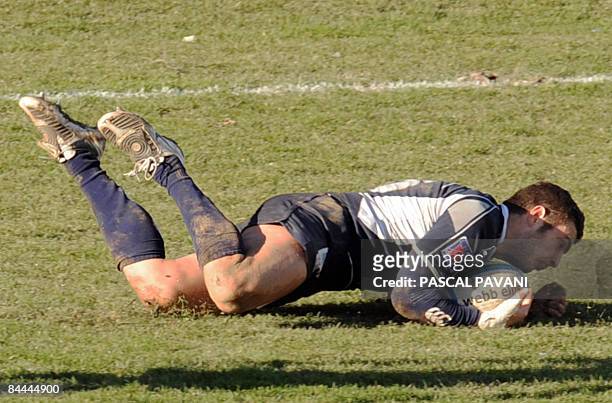 Castres' full back Thomas Bouquie scores a try during the European Cup rugby union match Castres vs London Wasps on January 25, 2009 in Castres. AFP...