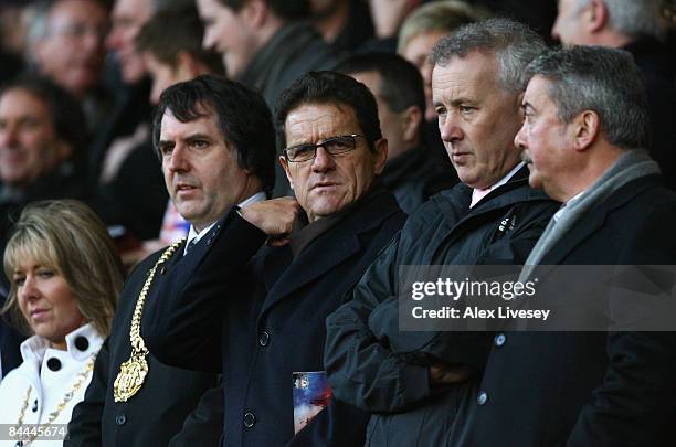 England Manager Fabio Capello watches from the stands with Liverpool Chief Executive Rick Parry during the FA Cup sponsored by E.ON Fourth Round...