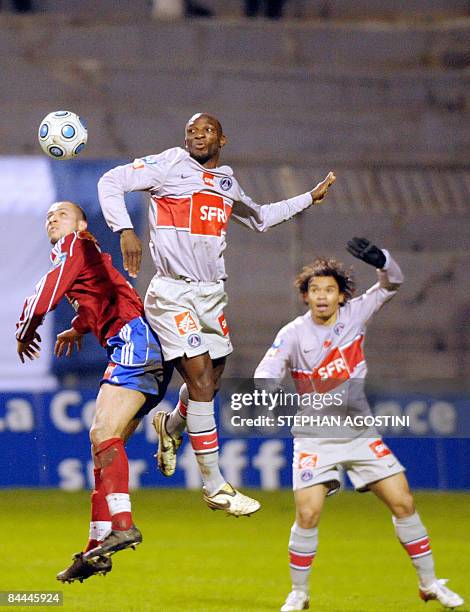 Ajaccio's forward Foued Kahlaoui fights for th ball with Paris' midfielder Mateja Kelman during their French Cup football match on January 25, 2009...