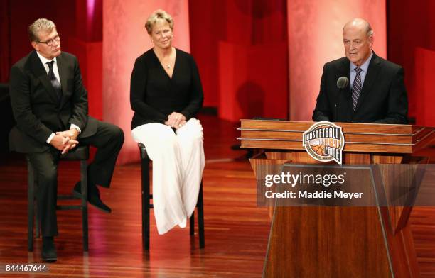 Naismith Memorial Basketball Hall of Fame Class of 2017 enshrinee Tom Jernstedt speaks as Naismith Memorial Basketball Hall of Famers Geno Auriemma...