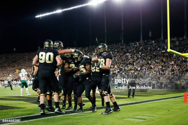 Tario Fuller of the Purdue Boilermakers celebrates with teammates after rushing for a touchdown in the second quarter of a game against the Ohio...