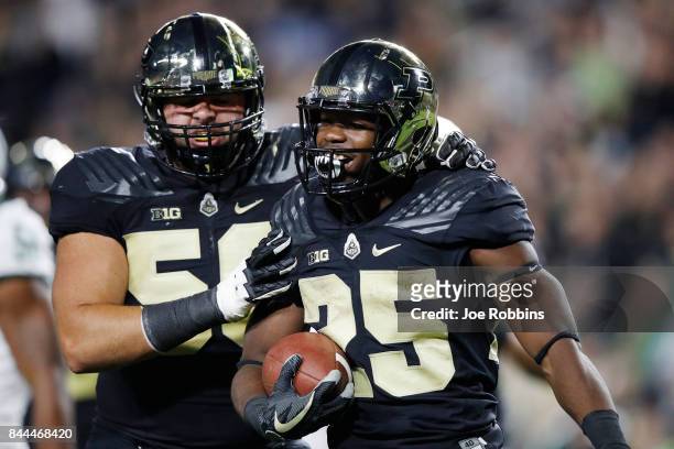 Tario Fuller of the Purdue Boilermakers celebrates after rushing for a touchdown in the second quarter of a game against the Ohio Bobcats at Ross-Ade...