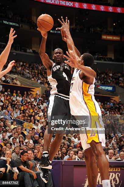 Michael Finley of the San Antonio Spurs goes up to make a pass against Andrew Bynum of the Los Angeles Lakers at Staples Center on January 25, 2009...