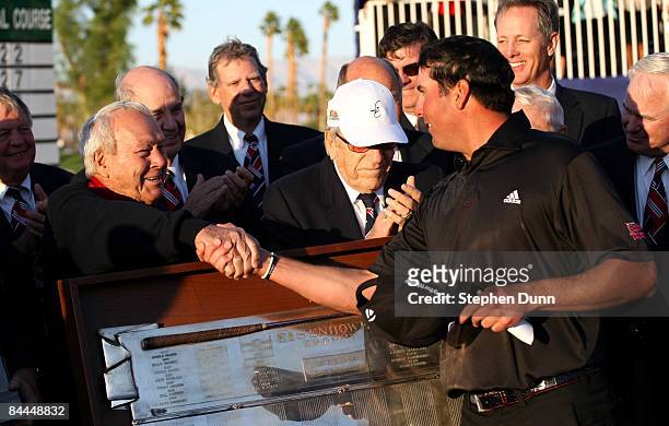 Pat Perez is congratulated by tournament host Arnold Palmer after Perez' three stroke victory on the Palmer Private course at PGA West during the...