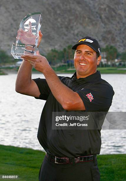 Pat Perez poses with the trophy after winning the Bob Hope Chrysler Classic at the Palmer Course at PGA West on January 25, 2009 in La Quinta,...