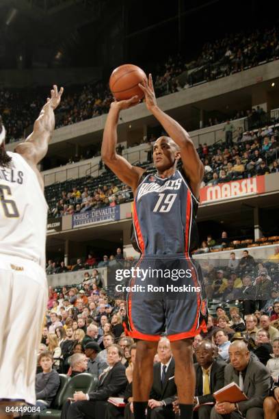 Raja Bell of the Charlotte Bobcats shoots over Marquis Daniels of the Indiana Pacers at Conseco Fieldhouse on January 25, 2009 in Indianapolis,...