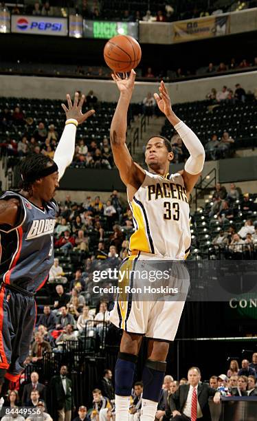 Danny Granger of the Indiana Pacers shoots over Gerald Wallace of the Charlotte Bobcats at Conseco Fieldhouse on January 25, 2009 in Indianapolis,...