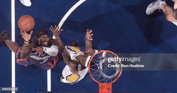 Gerald Wallace of the Charlotte Bobcats battles Marquis Daniels of the Indiana Pacers at Conseco Fieldhouse on January 25, 2009 in Indianapolis,...