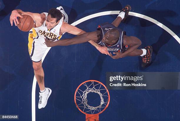 Jeff Foster of the Indiana Pacers rebounds over Emeka Okafor of the Charlotte Bobcats at Conseco Fieldhouse on January 25, 2009 in Indianapolis,...