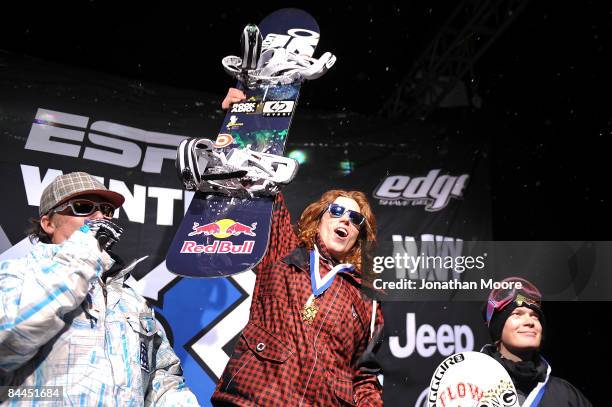Shaun White of Carlsbad, California celebrates as he takes the podium for the gold medal in the Men's Snowboard Superpipe Final at Winter X Games 13...