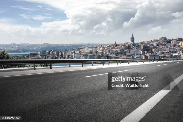 asphalt road with istanbul cityscape background. - historical istanbul stock pictures, royalty-free photos & images
