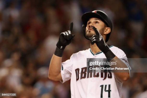 Reymond Fuentes of the Arizona Diamondbacks points to the sky after hitting a two run home run against the San Diego Padres during the fifth inning...