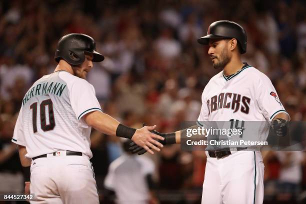 Reymond Fuentes of the Arizona Diamondbacks celebrates with Chris Herrmann after hitting a two run home run against the San Diego Padres during the...