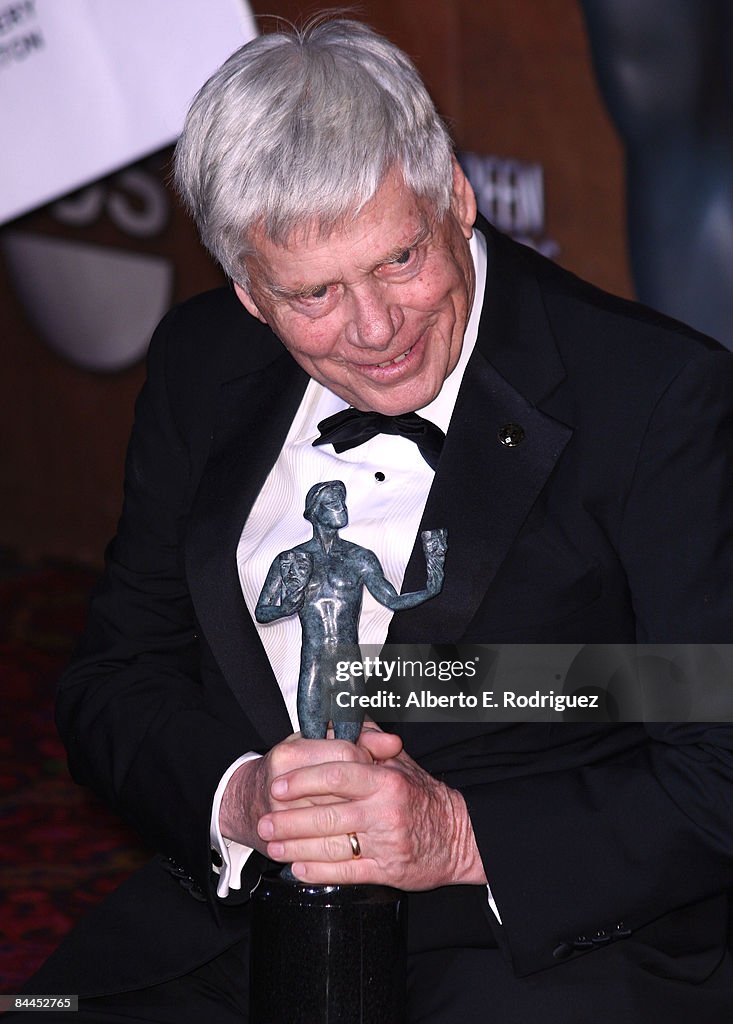 Actor Robert Morse poses with his award for Outstanding Performance