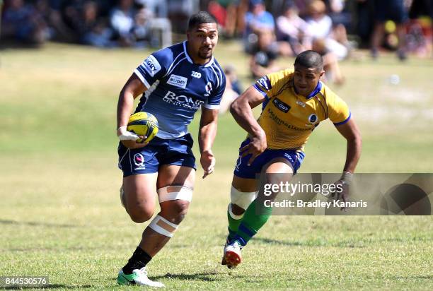 Chris Feauai-Sautia of Queensland Country breaks away from the defence during the round two NRC match between Queensland Country and Brisbane on...