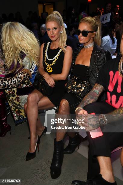 Nicky Hilton and Paris Hilton attend the Jeremy Scott Fashion Show during New York Fashion Week at Spring Studios on September 8, 2017 in New York...