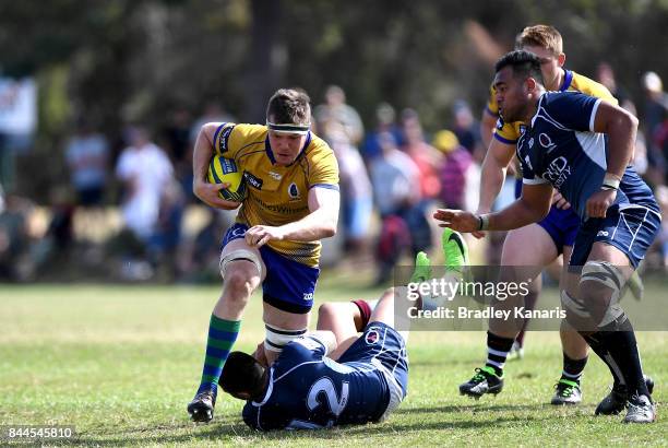 Dan Gorman of Brisbane City takes on the defence of Duncan Paia'aua of Queensland Country during the round two NRC match between Queensland Country...