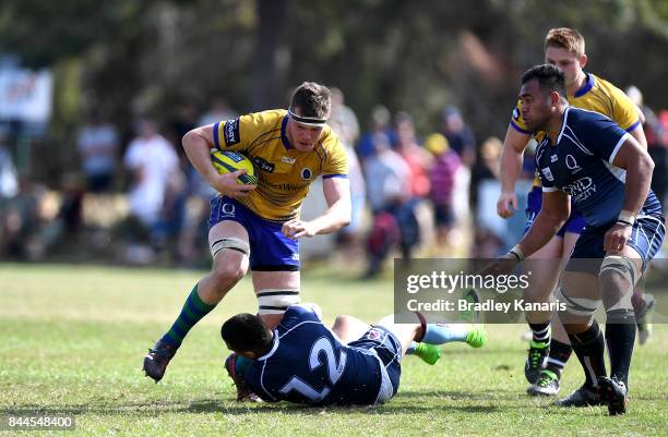 Dan Gorman of Brisbane City takes on the defence of Duncan Paia'aua of Queensland Country during the round two NRC match between Queensland Country...