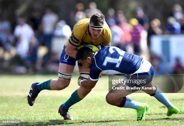 Dan Gorman of Brisbane City takes on the defence of Duncan Paia'aua of Queensland Country during the round two NRC match between Queensland Country...