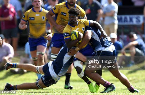 Moses Sorovi of Brisbane City is tackled during the round two NRC match between Queensland Country and Brisbane on September 9, 2017 in Noosa,...
