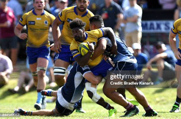 Moses Sorovi of Brisbane City is tackled during the round two NRC match between Queensland Country and Brisbane on September 9, 2017 in Noosa,...