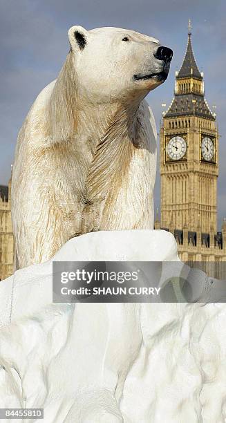 Life-like 16ft high sculpture of an iceberg featuring a stranded polar bear and its cub is pictured on the River Thames in London on January 26,...