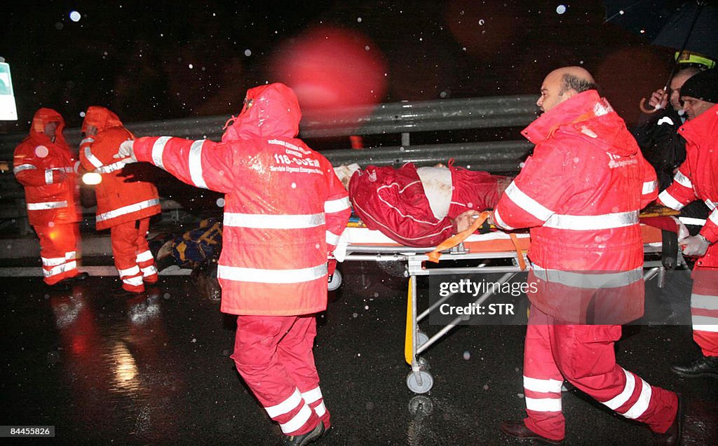 Rescuers carry an injured man who was in