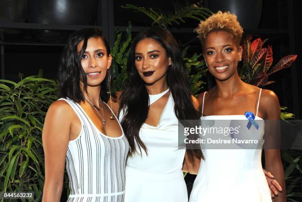 Designer Michelle Ochs, actress Shay Mitchell and designer Carly Cushine pose backstage for the Cushnie Et Ochs fashion show during New York Fashion...