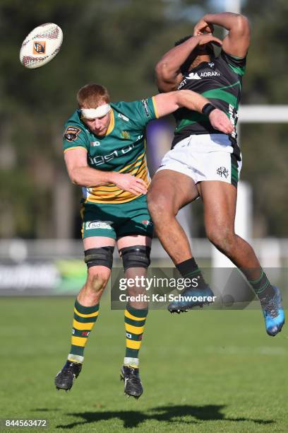 Phil Watson of Mid Canterbury and Loni Toumohuni of South Canterbury compete for a ball during the Heartland Championship match between Mid...