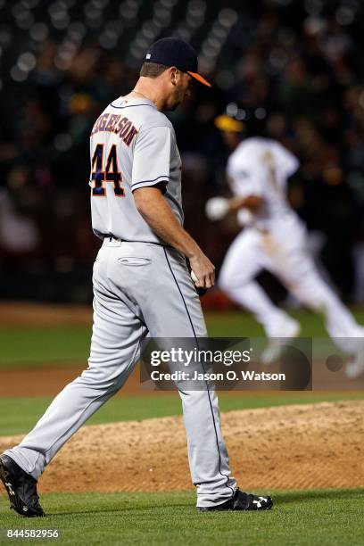 Marcus Semien of the Oakland Athletics rounds the bases after hitting a grand slam home run off of Luke Gregerson of the Houston Astros during the...