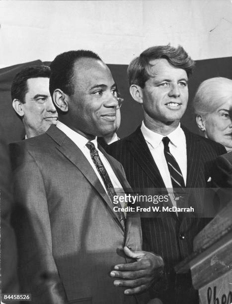 American Civil Rights activist and law student James Meredith and United States Senator Robert F. Kennedy stand together on a podium, New York, New...