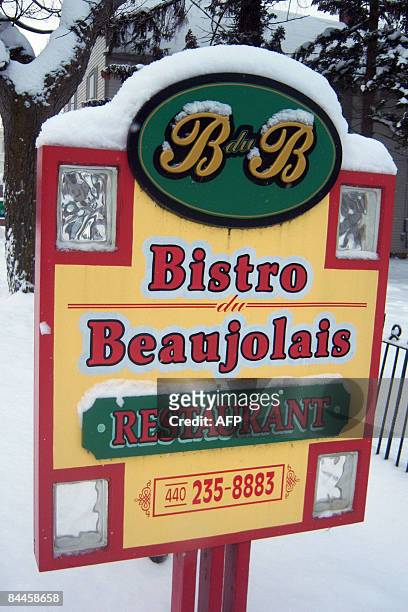 By Bryan Mitchell A sign is left standing for Bistro du Beaujolais, pictured on January 20, 2009 as the restaurant was reduced to ash and rubble...